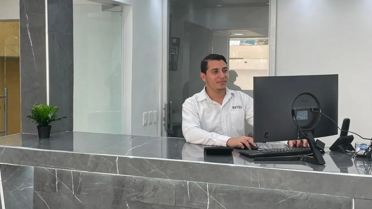 The front desk at Hotel Conquistador, with its grey marble counter